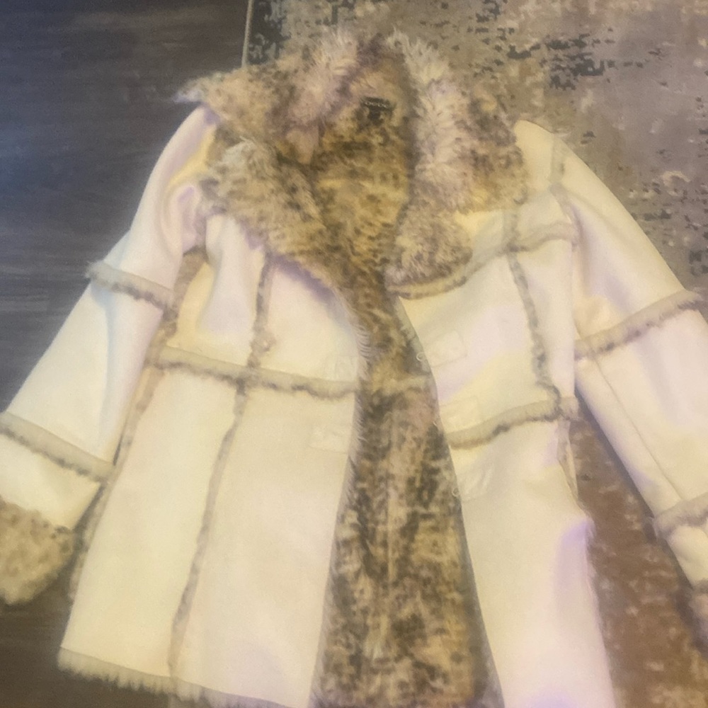 Bebe coat that is very stylish and sexy.  Nice and warm inside.  Great coat!